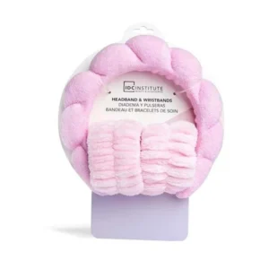Ensemble IDC Institute comprenant un bandeau et des bracelets pour la routine skincare, coloris rose et lilas.