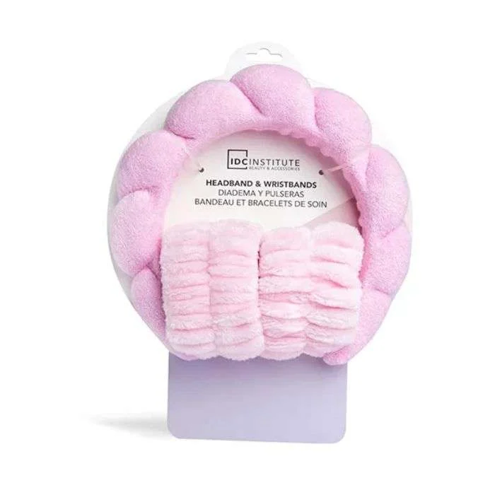 Ensemble IDC Institute comprenant un bandeau et des bracelets pour la routine skincare, coloris rose et lilas.
