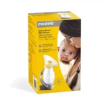 Recueil-lait en silicone Medela avec socle-ventouse, bouchon et cordon de sécurité.