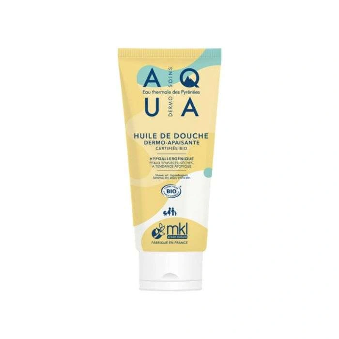 Petit flacon de 100 ml de MKL Aqua Huile de Douche Dermo Apaisante, soin lavant de voyage sans sulfates pour peaux sèches et sensibles.