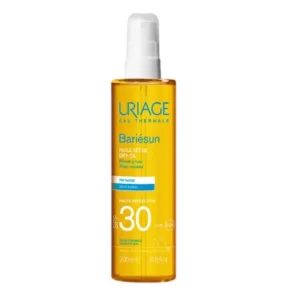 Uriage Bariésun huile sèche SPF 30 en flacon spray de 200ml, haute protection solaire nourrissante et sublimatrice pour le corps et les cheveux.