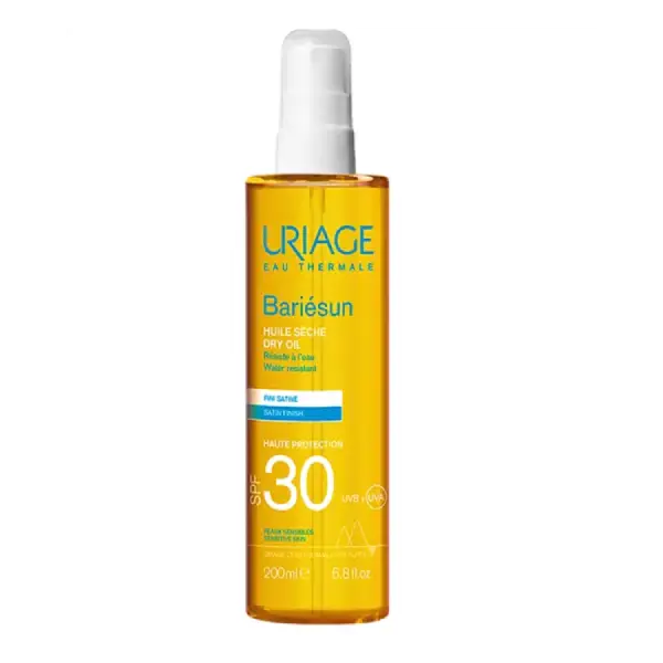 Uriage Bariésun huile sèche SPF 30 en flacon spray de 200ml, haute protection solaire nourrissante et sublimatrice pour le corps et les cheveux.