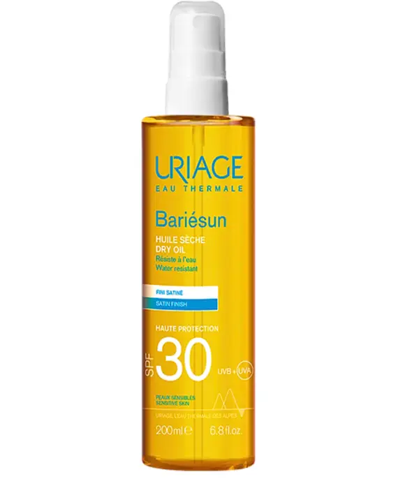 Uriage Bariésun huile sèche SPF 30 en flacon spray de 200ml, haute protection solaire nourrissante et sublimatrice pour le corps et les cheveux.